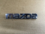 99-05 MAZDA MIATA MX5 MX-5 REAR EMBLEM LOGO BADGE SYMBOL 1999-2005 — Mazda Miata MX-5 OEM part product photo