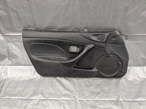 2001–2005 Mazda Miata MX-5 NB Driver Door Panel Black OEM NC10-59-590 01-05 — Mazda Miata MX-5 OEM part product photo