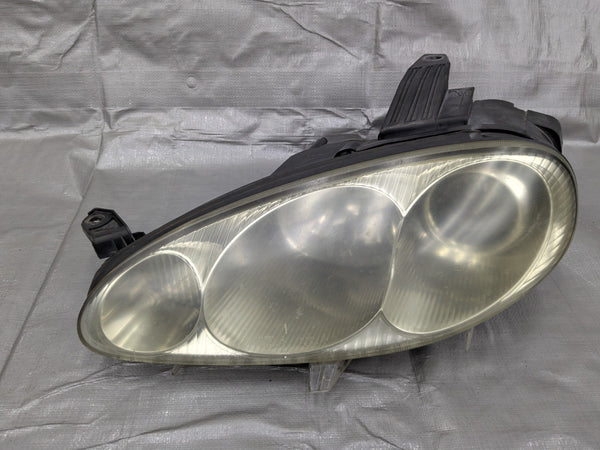 2001–2005 Mazda Miata Mx-5 NB2 OEM Driver Headlight Assembly N067-51-0L0 01-05 — Mazda Miata MX-5 OEM part product photo