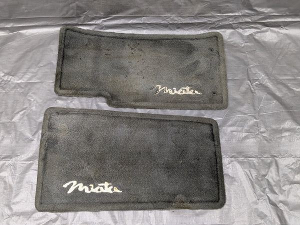 1999-2005 Mazda Miata MX-5 OEM Black Carpet Floor Mats Set w/ Logo NC10-V0-310 — Mazda Miata MX-5 OEM part product photo